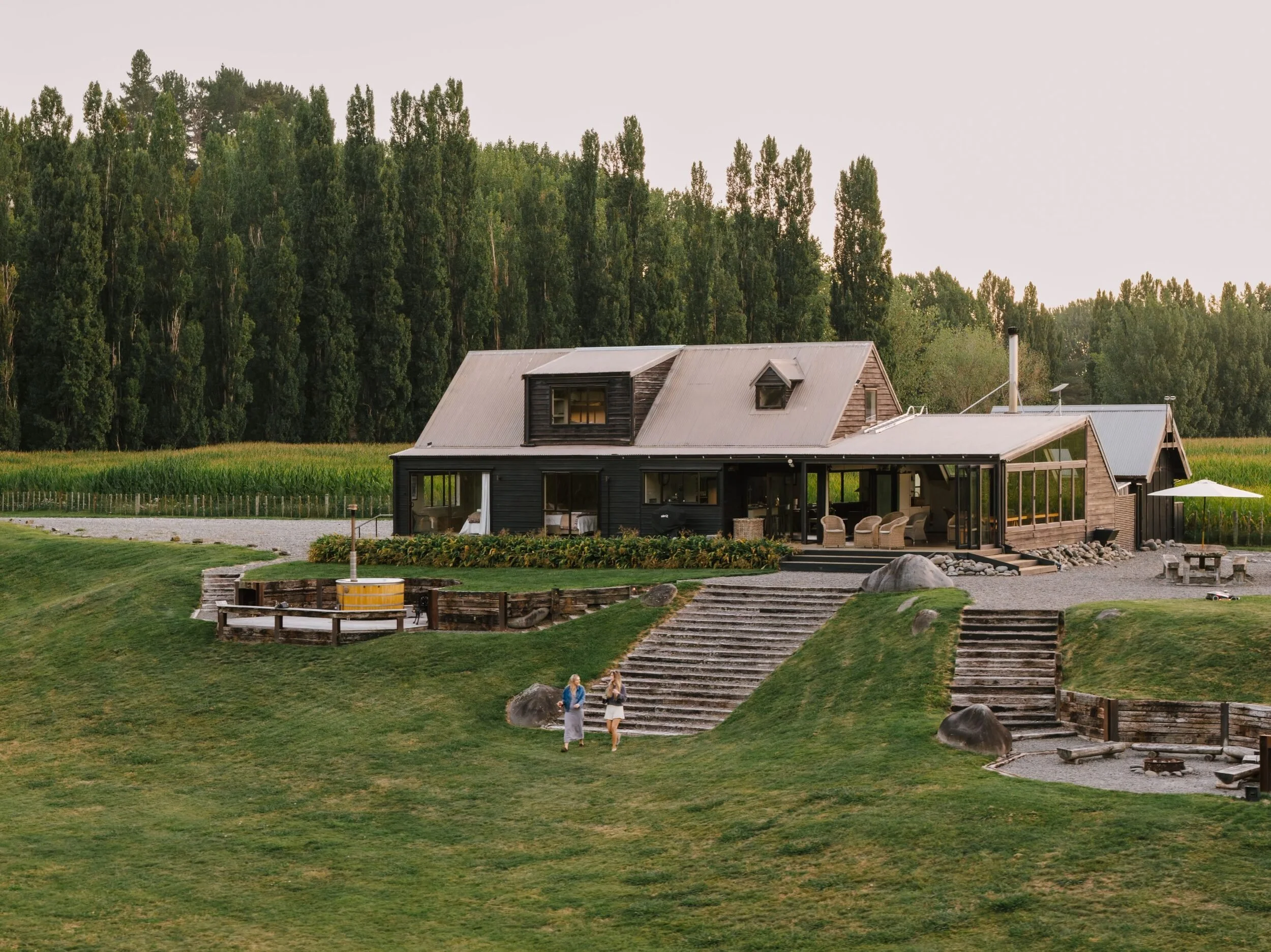 Rathmoy Estate Riverside lodge exterior at dusk