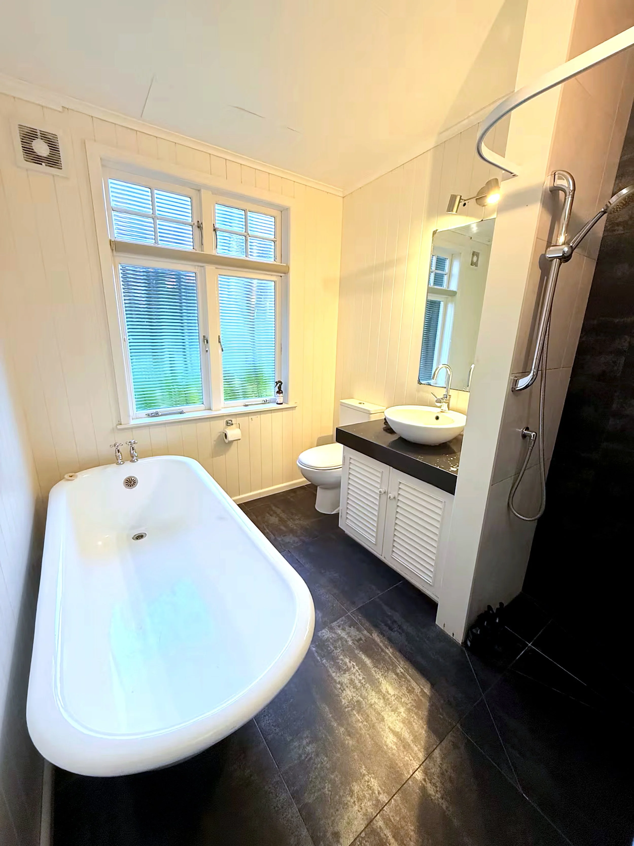 Farmstead country bathroom with cast iron bath at Rathmoy Farmhouse in Rangitikei near Manawatu.