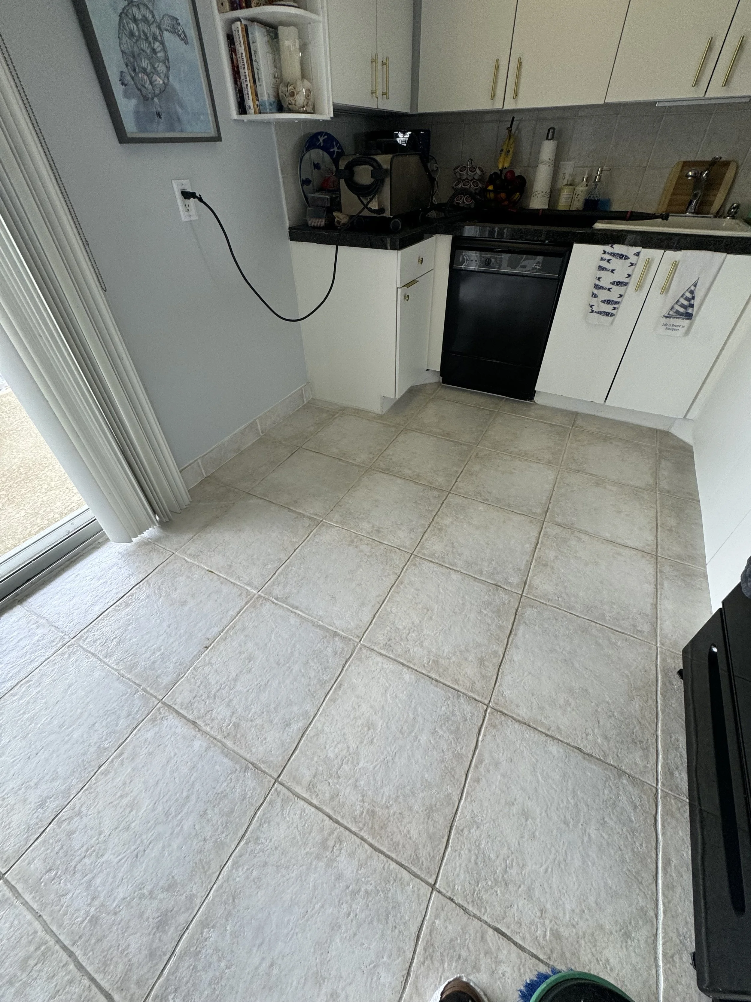 Beige kitchen tile flooring treated with premium Caponi grout seal in Fort Lauderdale.