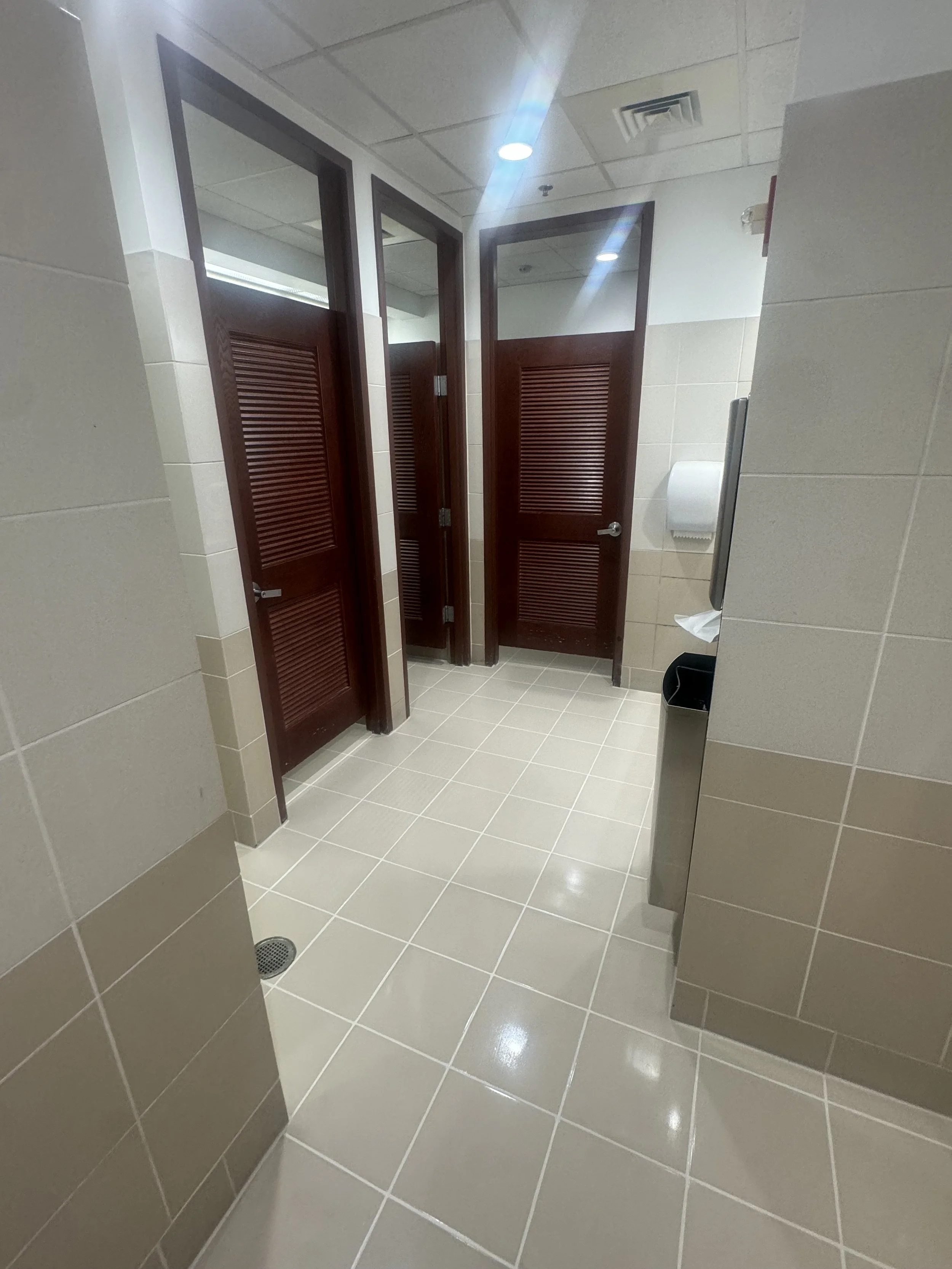 Commercial public restroom tile floor restored with HEPA extraction in Fort Lauderdale.