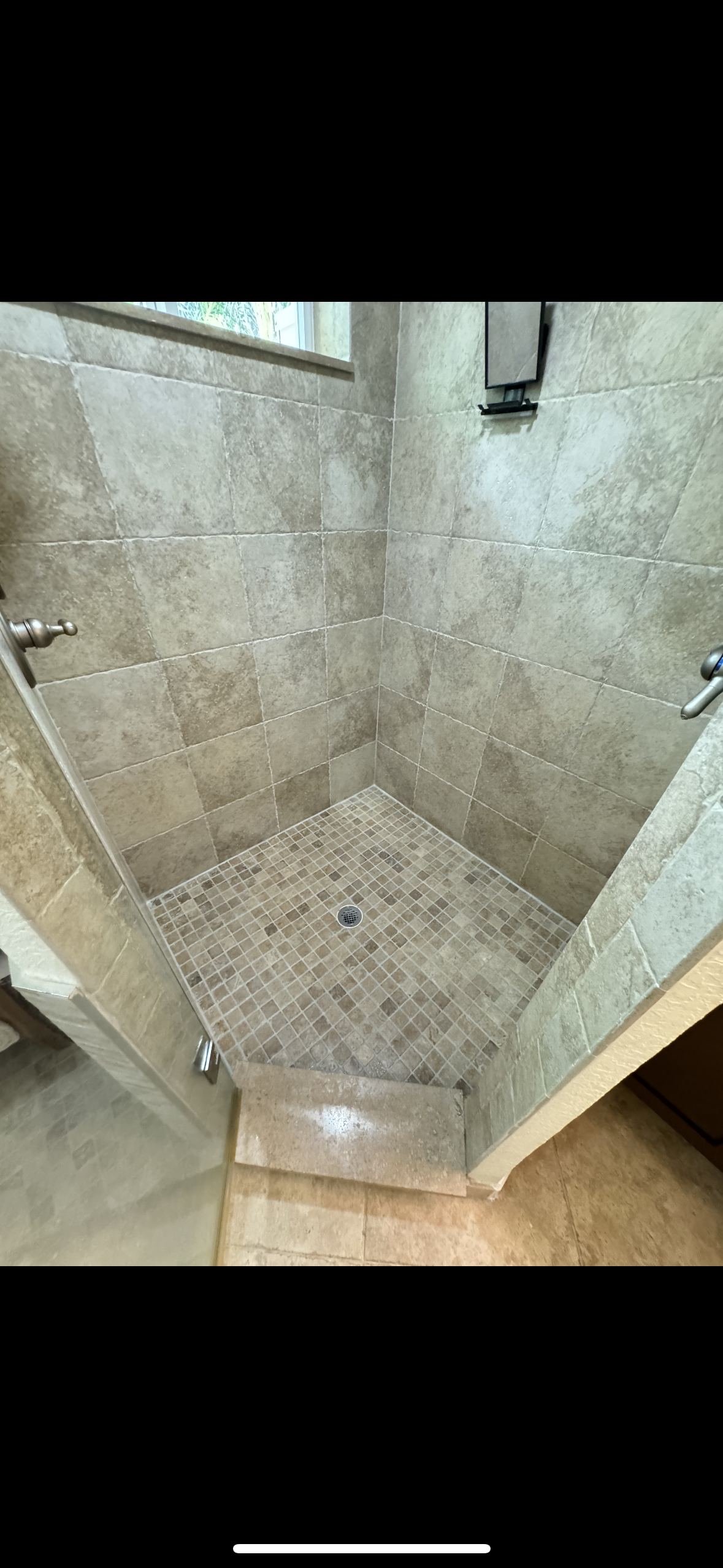 Walk-in shower featuring tan mosaic tiles and Litokol joint replacement in Fort Lauderdale.