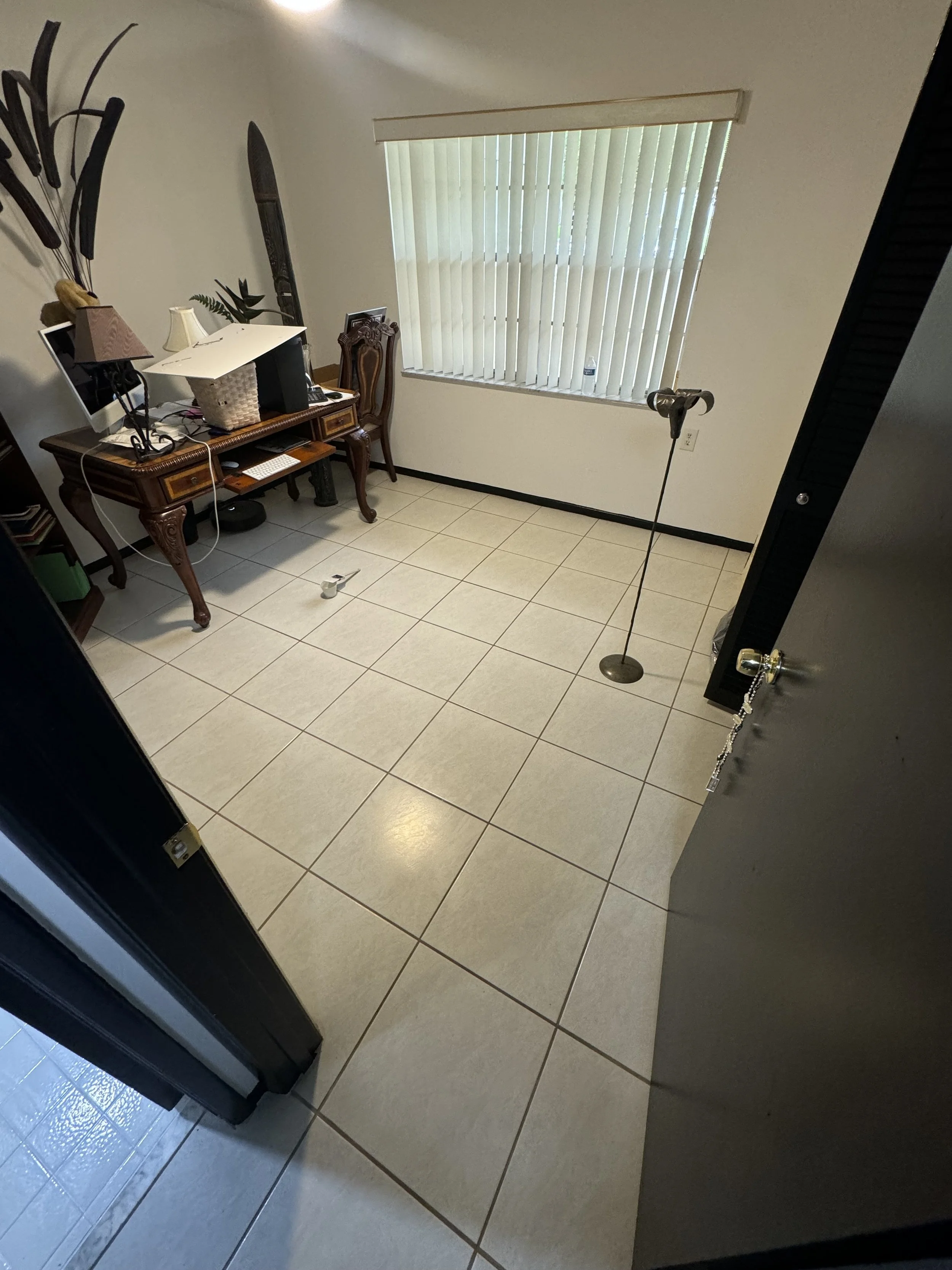 Home office tile flooring restored with Caponi epoxy color sealing in Boca Raton.