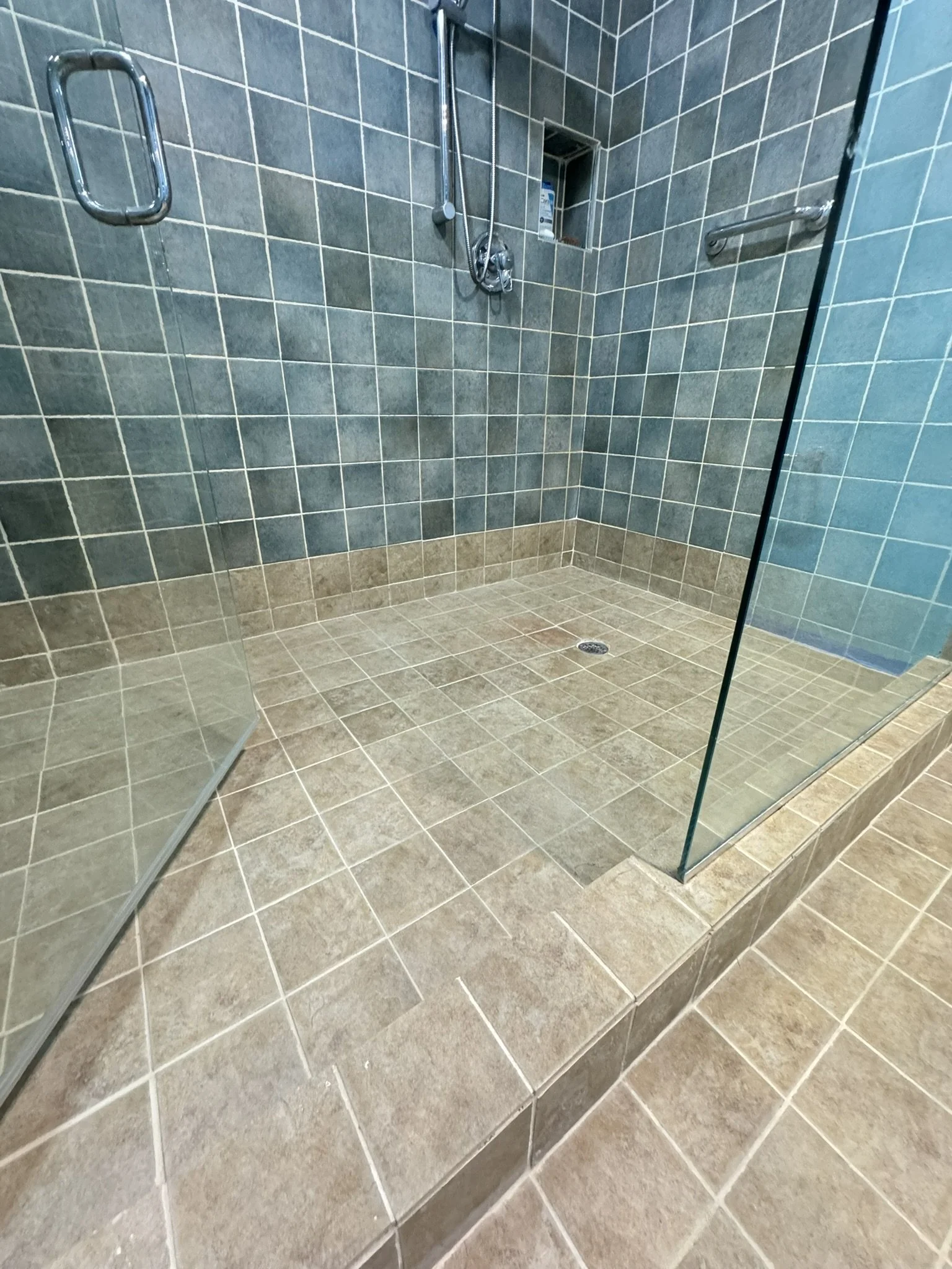 Luxury tiled shower enclosure featuring Litokol structural caulking in Coral Springs.
