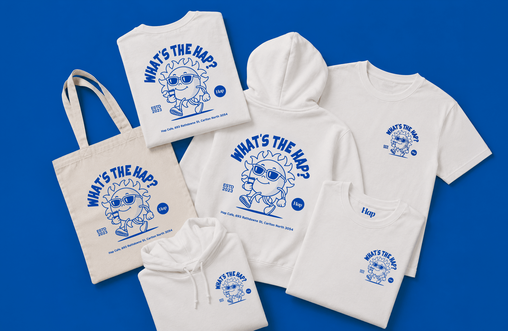 Custom merchandise collection for Hap Cafe featuring illustrated T-shirts, hoodies and tote bags with bespoke mascot artwork for café branding and retail merchandise.