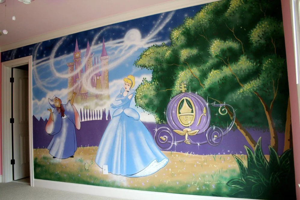A mural of Cinderella and her fairy godmother in a magical forest with a purple pumpkin carriage and a castle in the background.