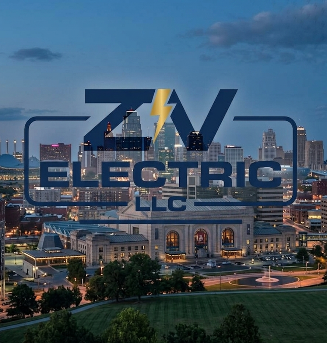 Overlay of electric LLC logo with a yellow lightning bolt, on a city skyline background at dusk, featuring skyscrapers and a historic train station building.
