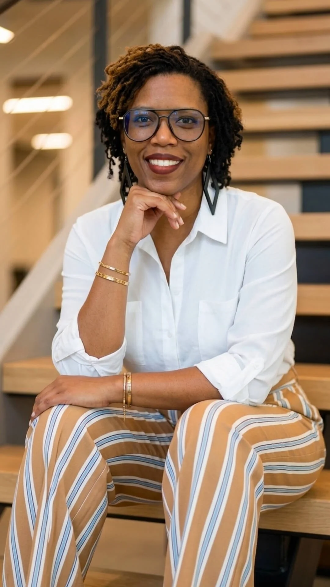 Founder of Tyloe Studio, smiling warmly as she introduces her approach to business operations
