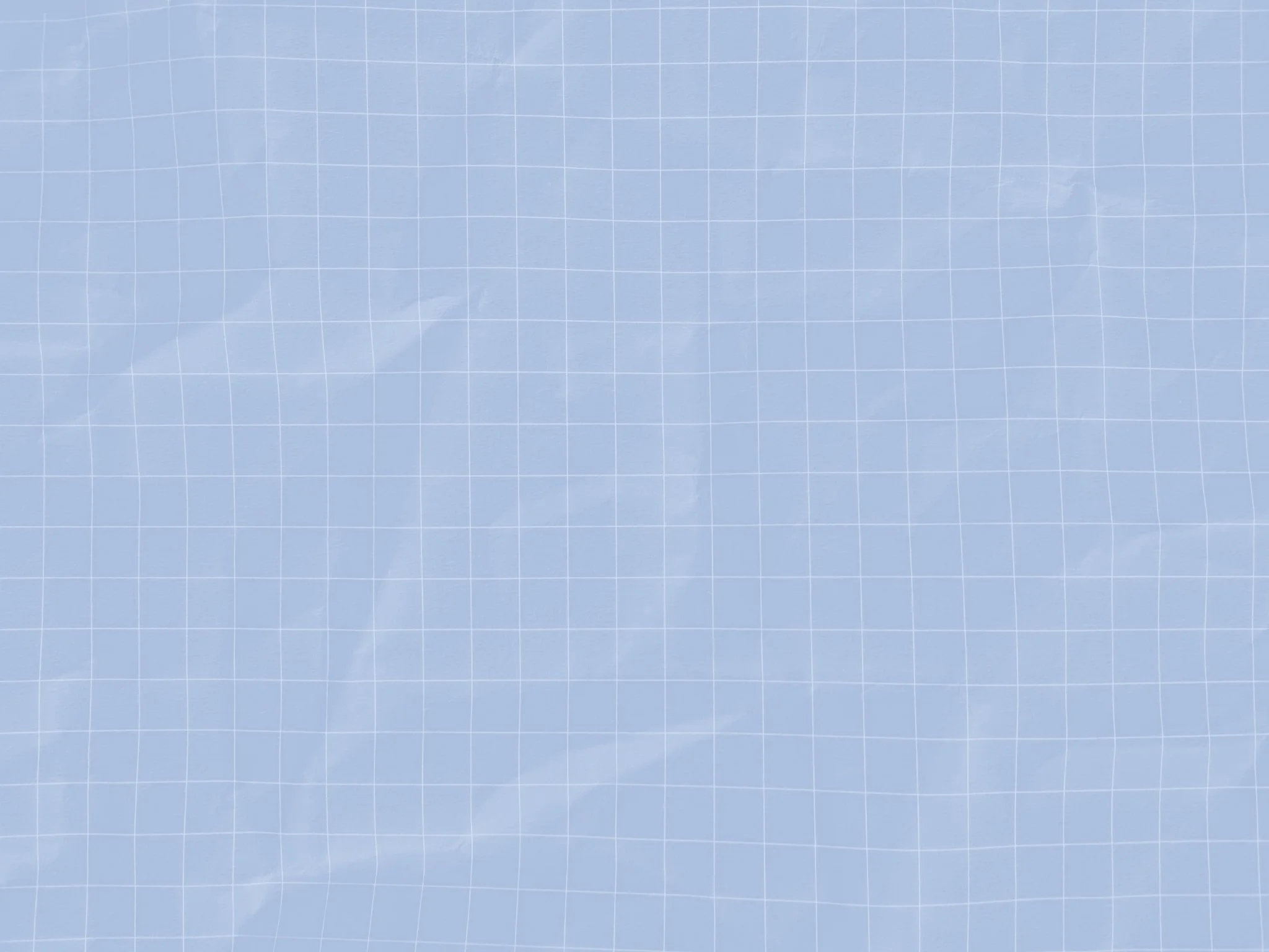 A blue grid-patterned cutting mat with faint white lines and subtle wrinkling.