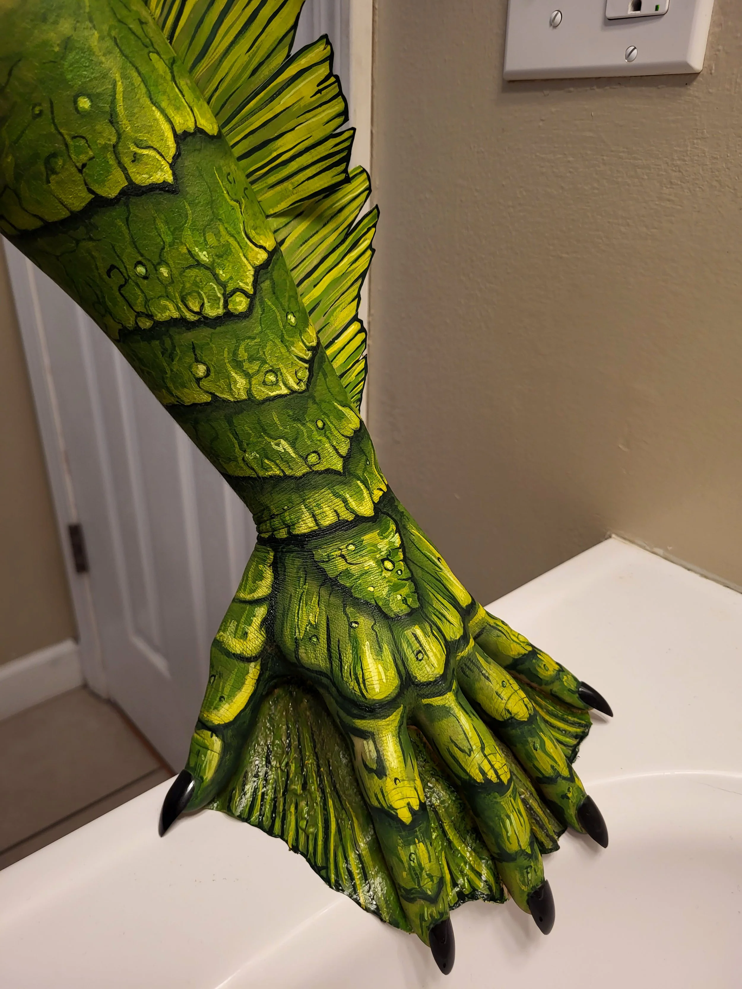Detailed makeup illusion body painting done on an arm by kim witte witty of witte artistry