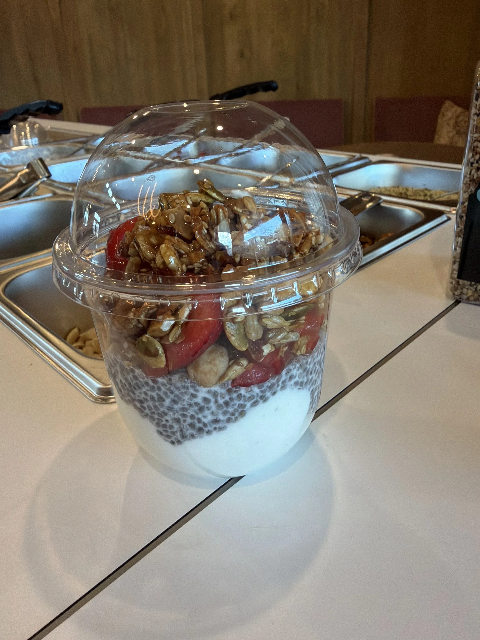 Greek yogurt parfait cup with chia seeds, strawberries and honey granola at Front Porch Social's Protein Power Bar