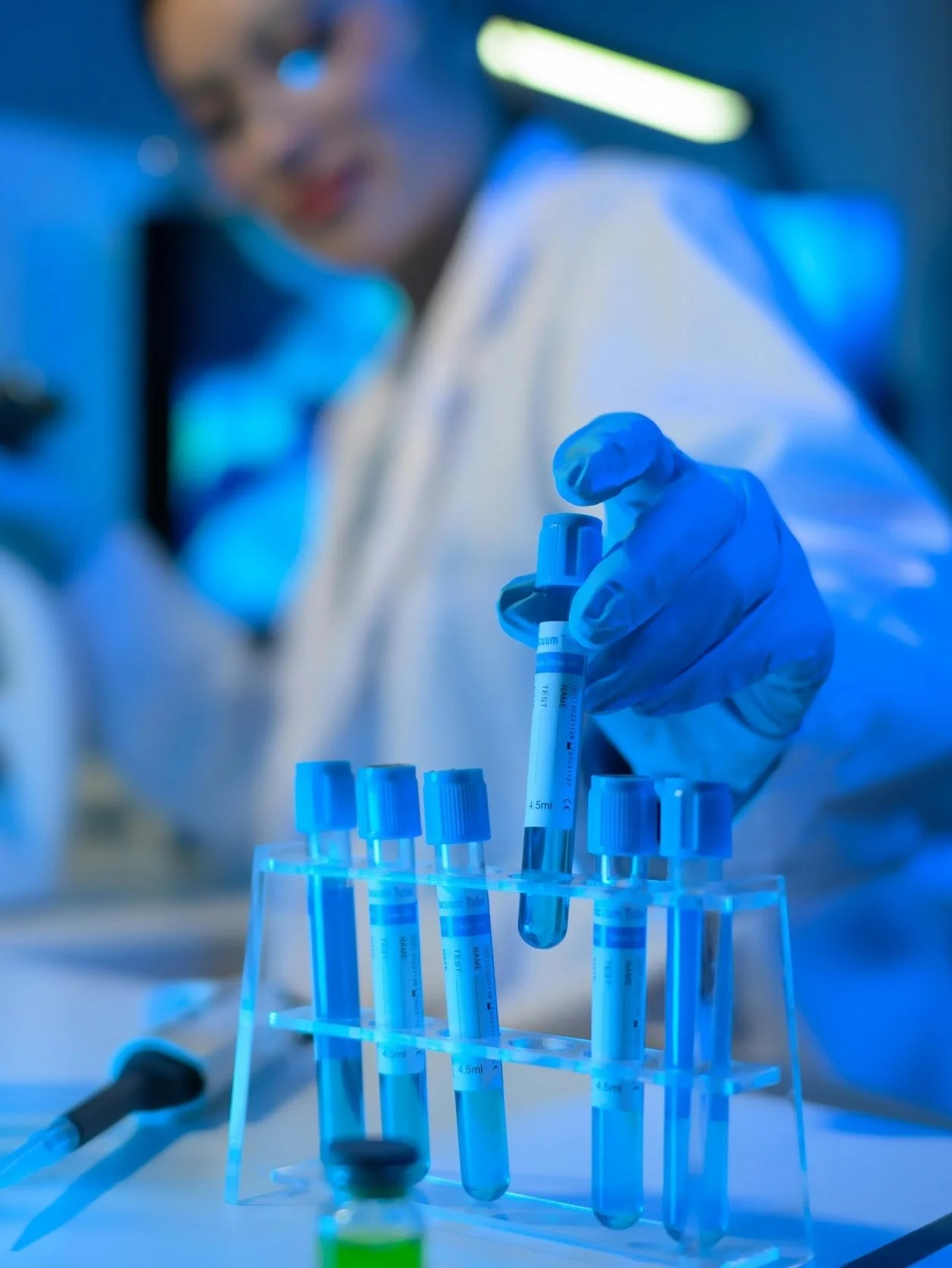 Scientist holding a test tube in a modern lab