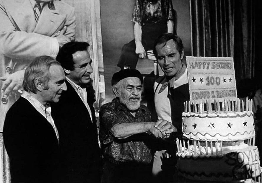 Celebrating with E.G. Robinson and Charleton Heston on the set of Soylent Green