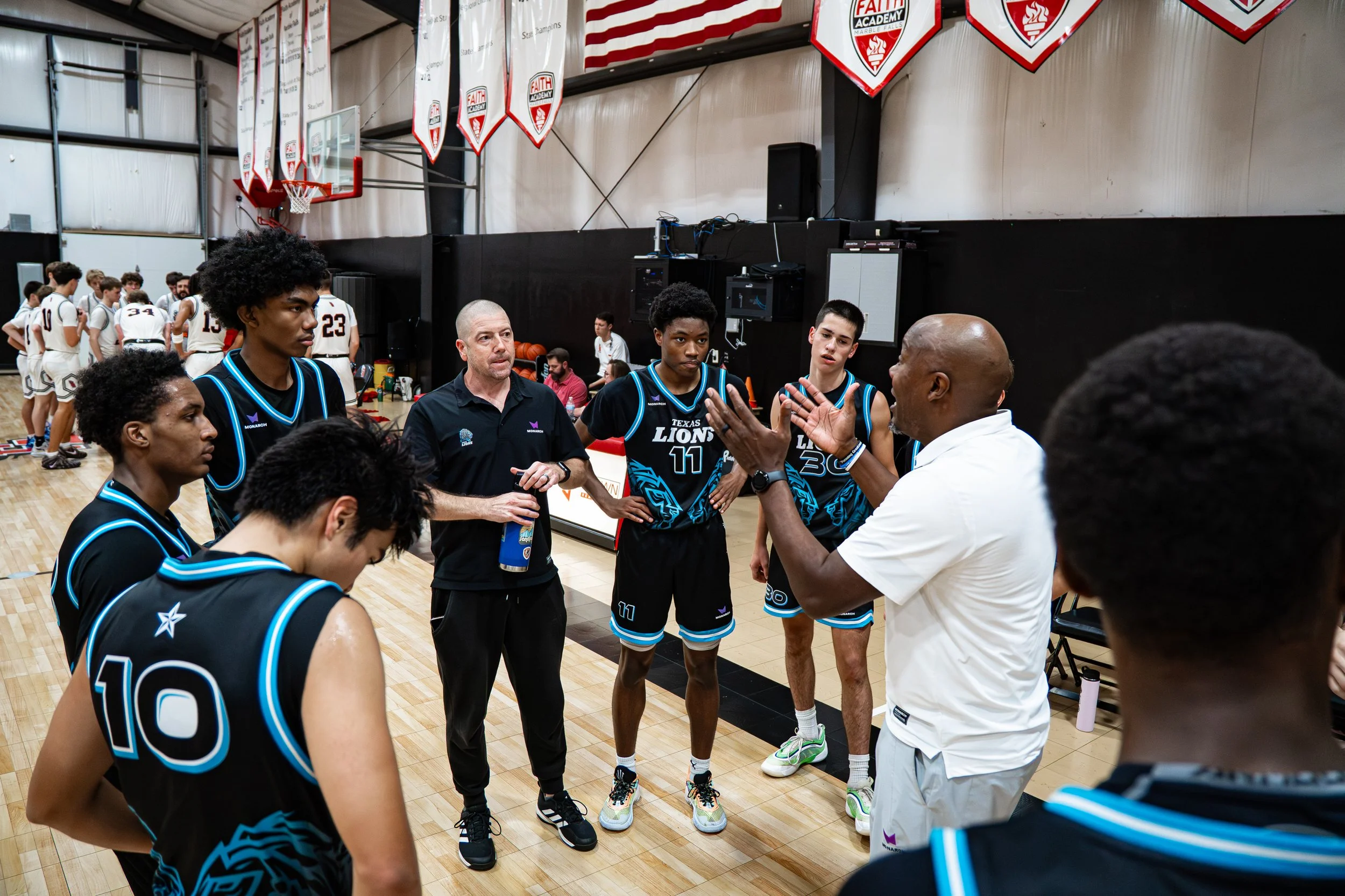 Texas Lions Varsity team in the huddle, playing their next plays.