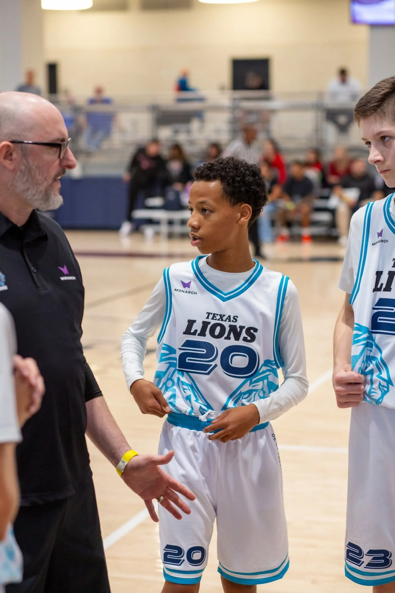 Coach Wade Slaton with the Texas Lions Basketball team.