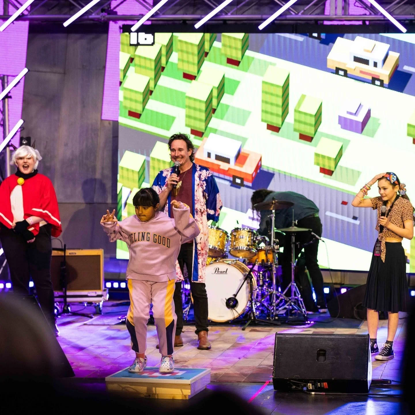 Kids playing Crossy Road on stage at Fed Square with custom controller by Louie Roots