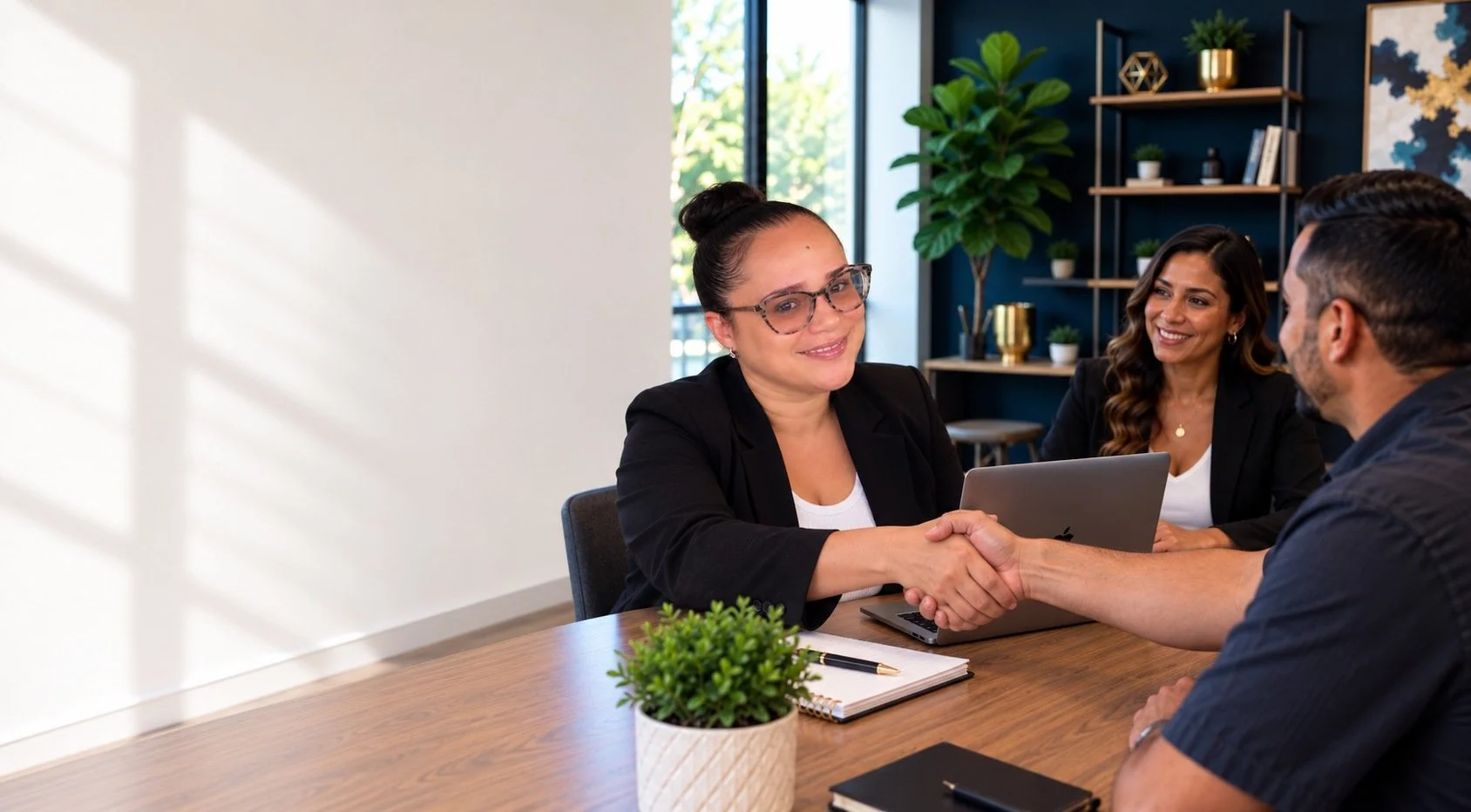 Website and marketing services consultation with a small business owner discussing website strategy, SEO, and business growth.