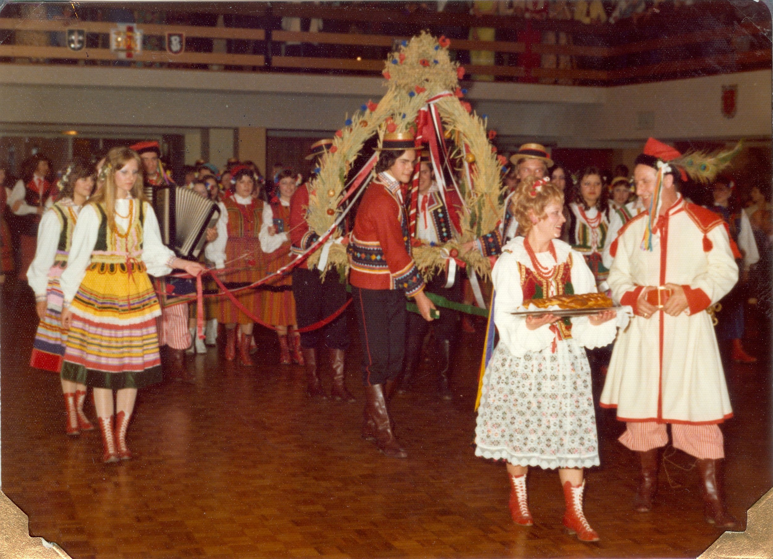 Dożynki harvest festival at Dom Polski, with a decorated harvest wreath and Polish folk costumes.