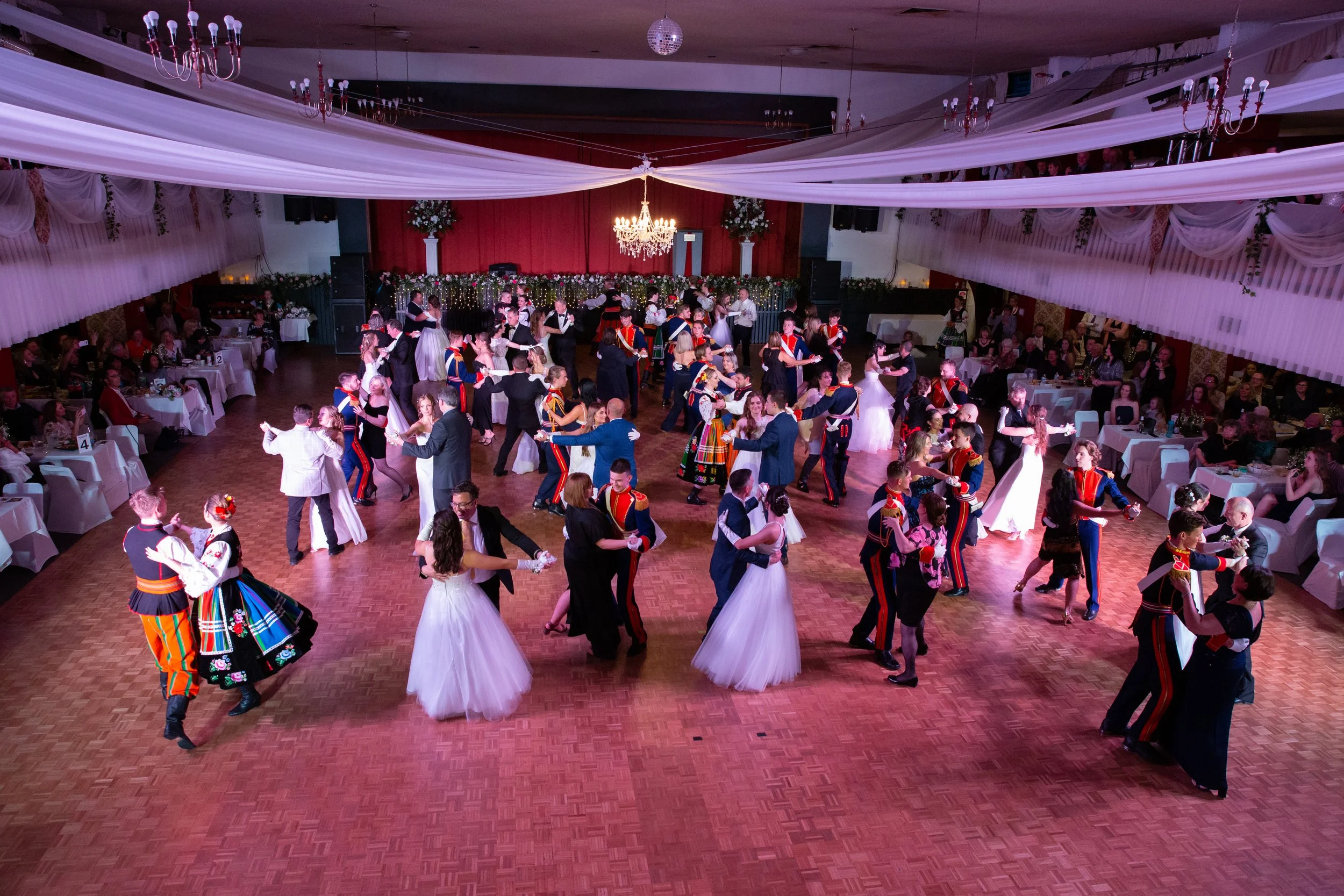 Polish folk dancers in traditional costume performing at a gala dinner at Dom Polski.