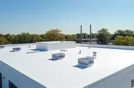 Rooftop with HVAC units and vents under a clear blue sky