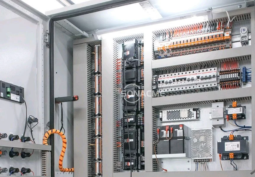 An electrical control panel with circuit breakers, wiring, and electronic components.