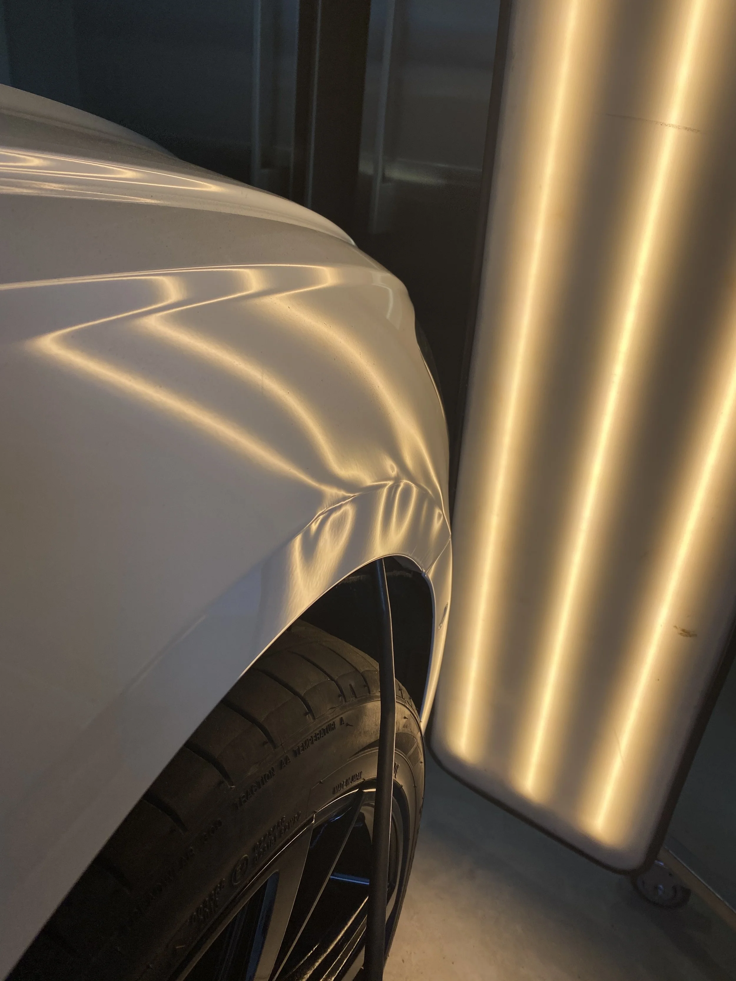 Mobile paintless dent repair results showing restored panel finish - Sydney wide service
