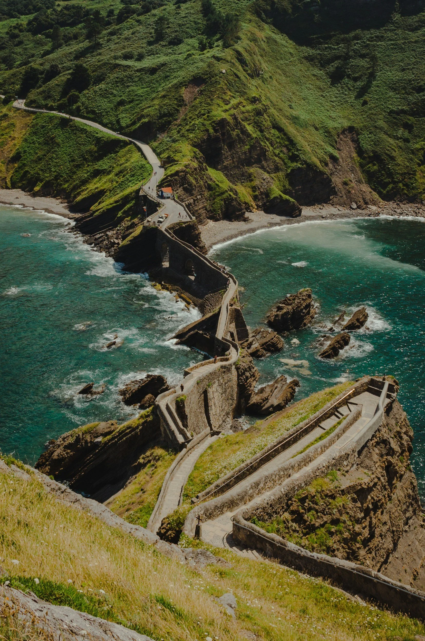 San Juan de Gaztelugatxe on the Basque coast of Spain, with a winding coastal path overlooking the ocean