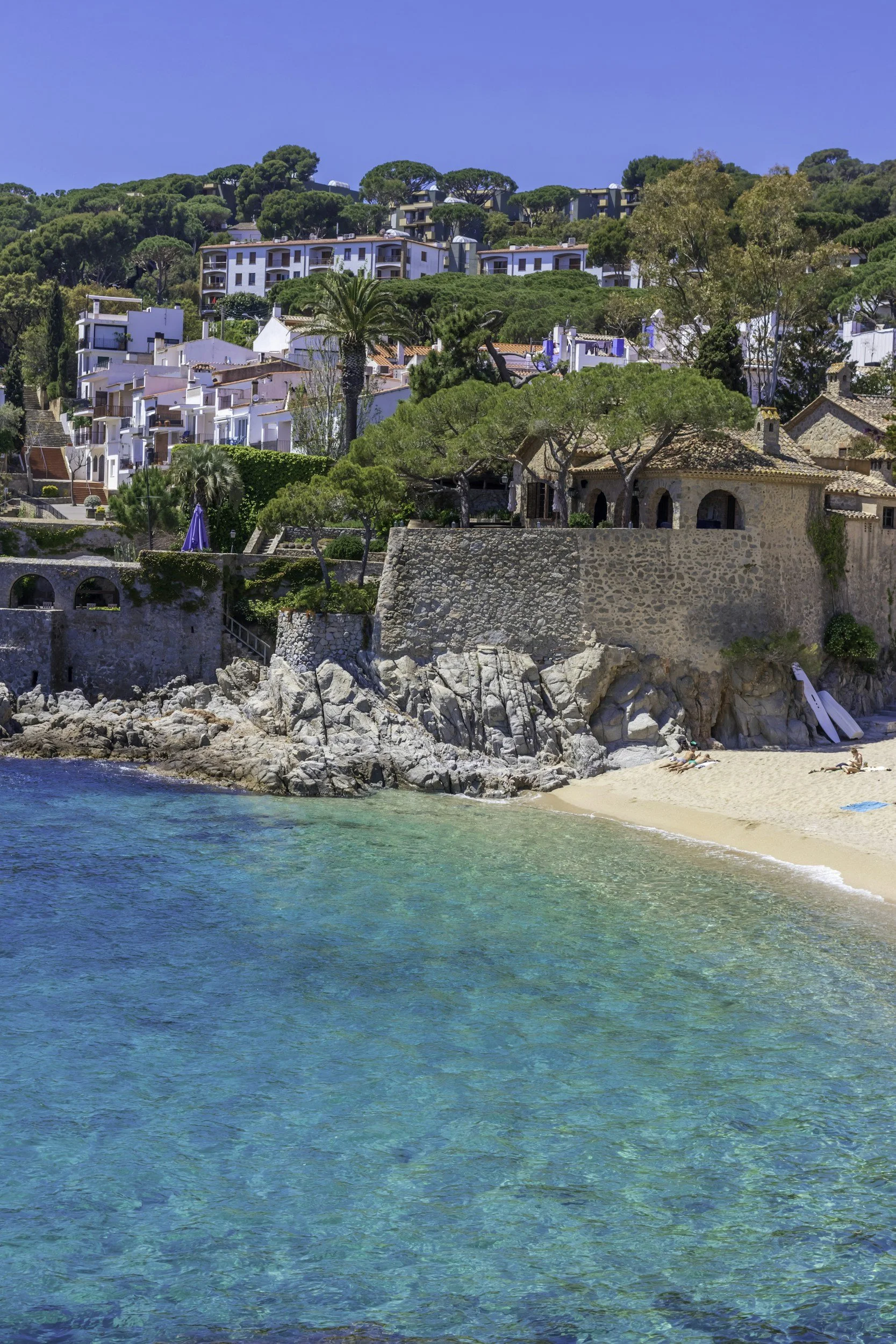 Turquoise beach on the Costa Brava in Spain, surrounded by rocky coastline and Mediterranean scenery