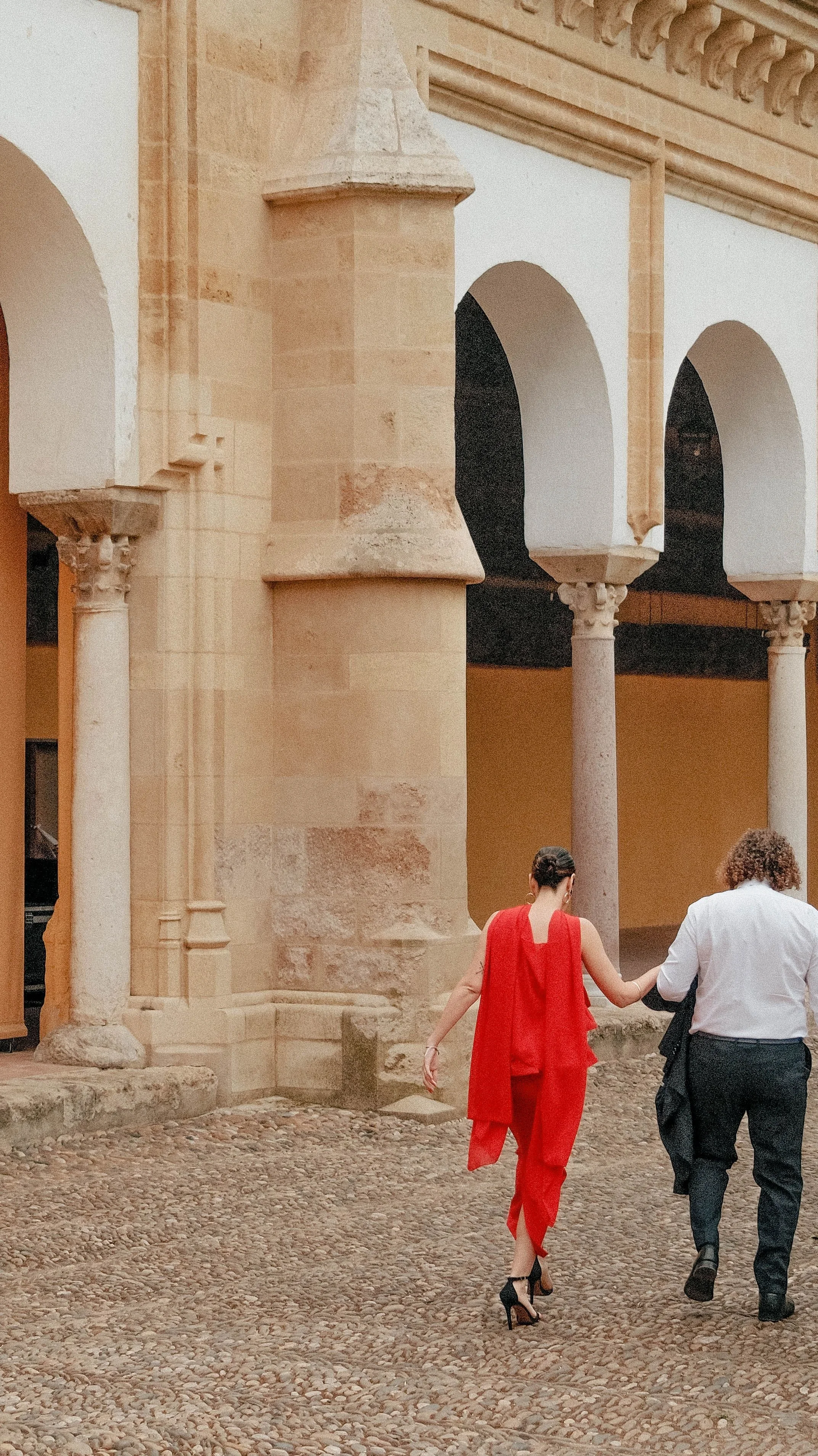 Couple exploring the historic streets of Córdoba, Spain.