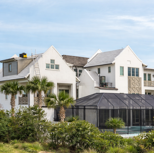 two-storey Florida estate lot with pool cage and gabled roofline