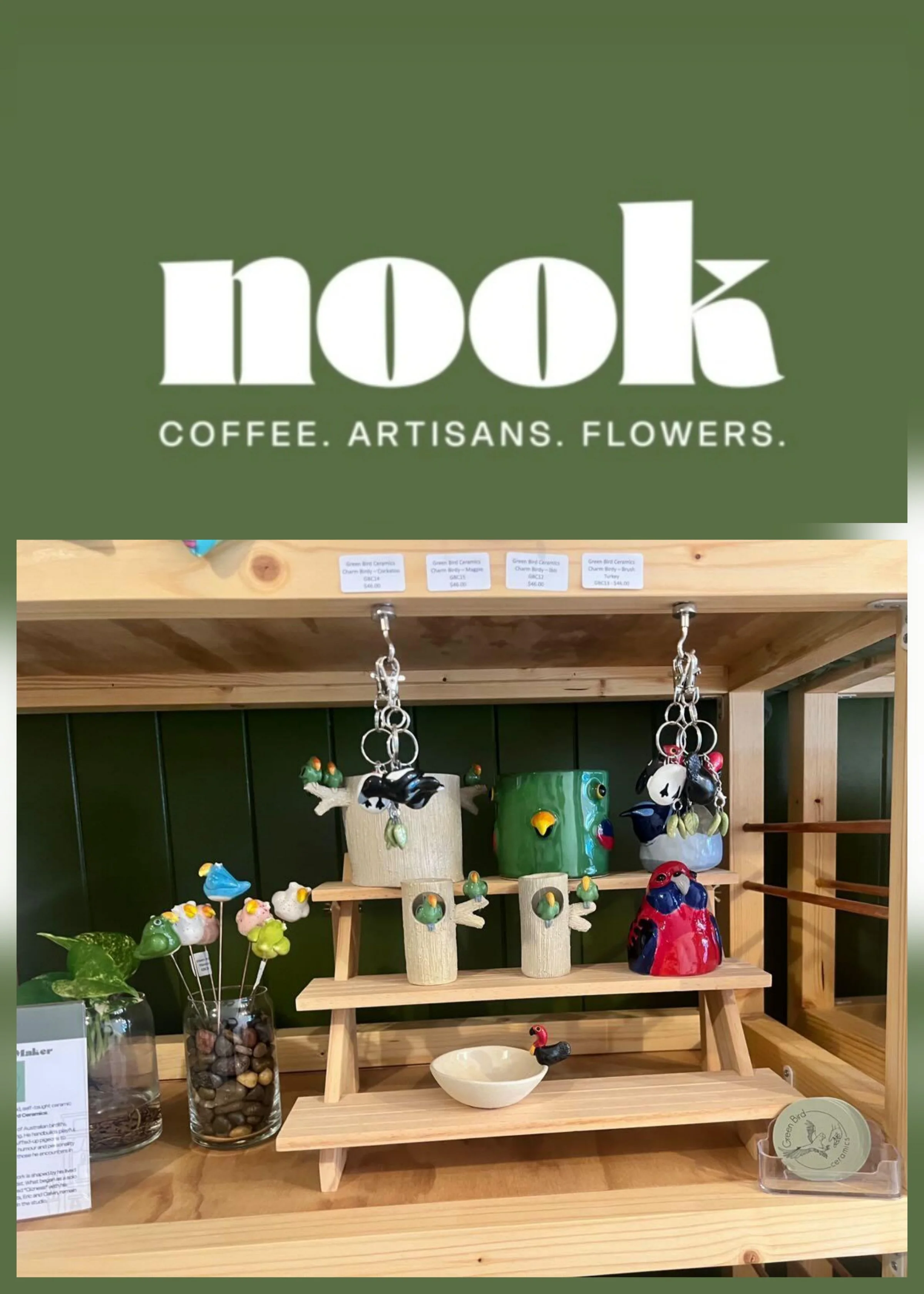 A photograph of Green Bird Ceramics products such as parrot and bird vases, planters, key chains, sculptures, plant stakes and other ceramic art gifts stocked on a shelf at Nook in Northgate, Brisbane.