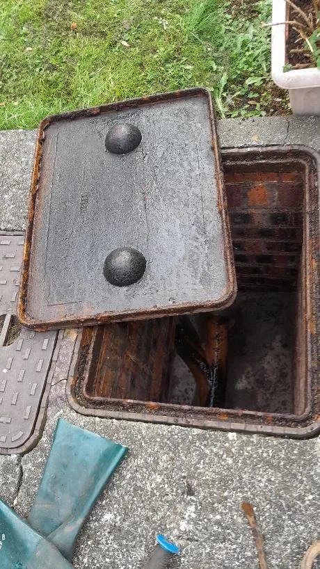 A blocked manhole has been cleared the system is now flowing to the main sewer