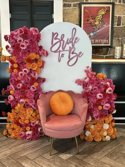 One of our faux floral arches, backdrop and rental chair at Greystone in Newtown PA made for the cutest bridal shower party.