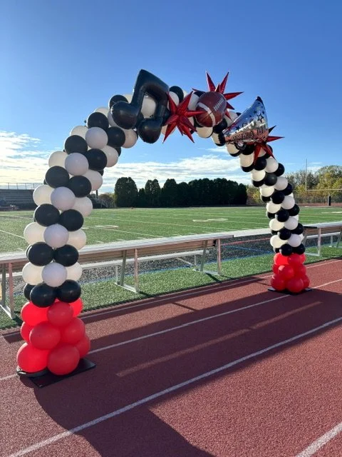 This red, white and black balloon arch was a great photo-opp at homecoming in Trevose-Feasterville PA.  Balloon arches are perfect for school events, fundraisers and grand openings.
