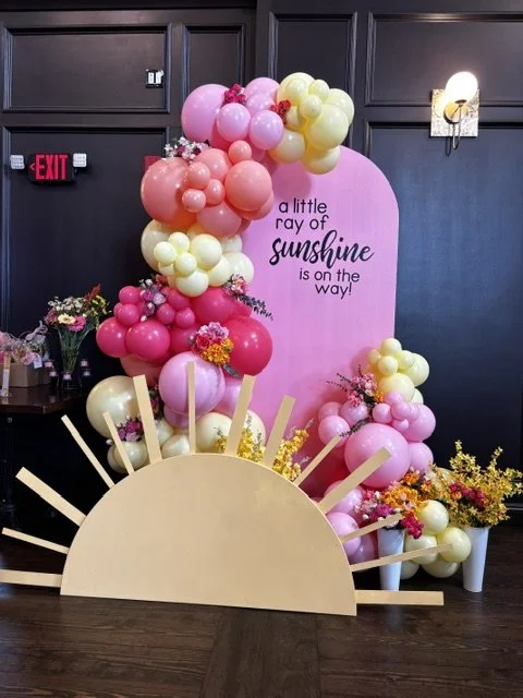 A little ray of sunshine is on the way baby shower balloon backdrop
