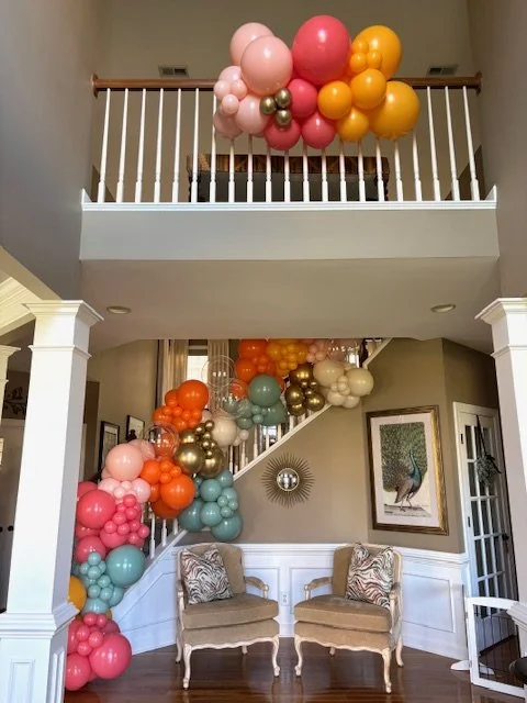 These stairway balloons in fall colors played a major role in this baby shower.