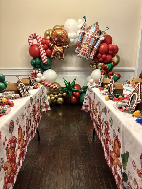 A premium Christmas themed premium balloon ring created the perfect backdrop for this cookie decorating party in Richboro PA.