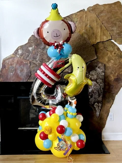 Custom 4th birthday balloons for a Curious George Theme birthday party in Yardley PA