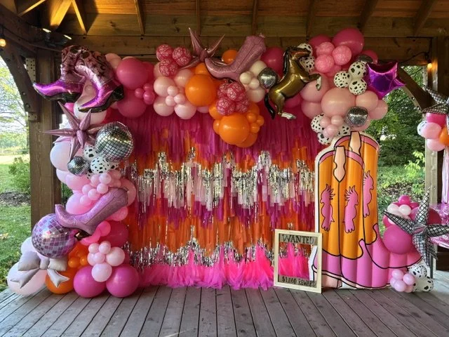 This fringe backdrop was the perfect photo-opp for a 5th birthday party in Bristol PA.
The balloon arch surrounding the fringe backdrop was just perfect for the pink pony show themed birthday party.