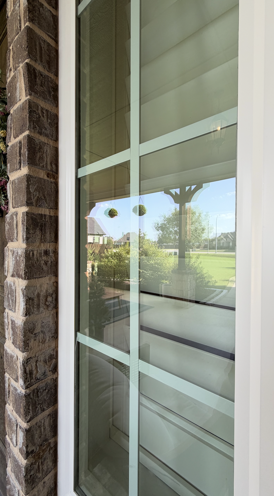 The long, tall exterior window is extremely clean, with now removed dust, dirt, pollen, and weather residue. This window now shines from professional cleaning.
