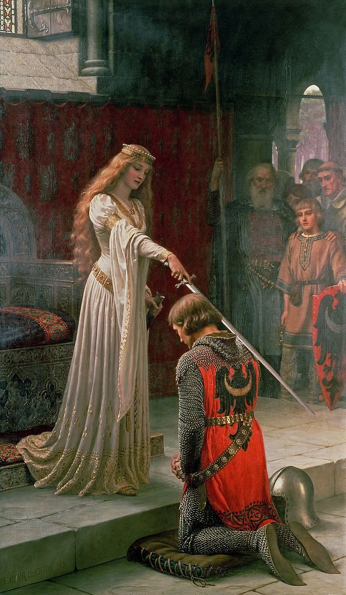 A medieval knight is kneeling before a woman in a long, elegant dress with golden details, who is touching his shoulder with a sword, symbolizing a knighthood ceremony. The scene is set indoors with a red backdrop and onlookers in the background.