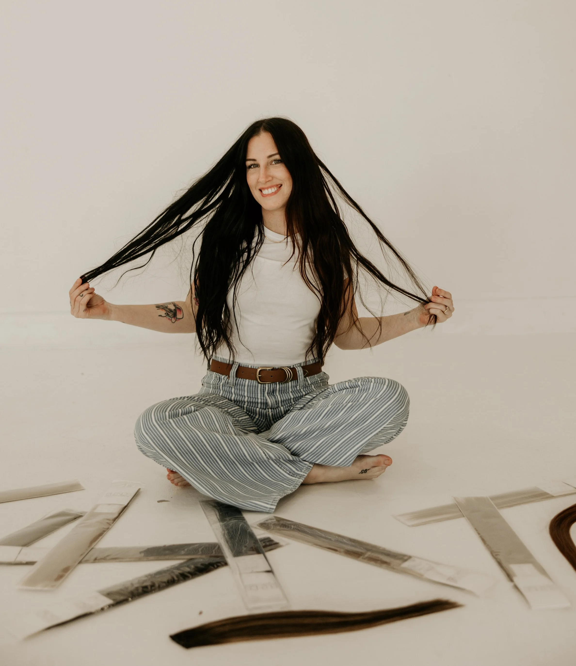 stylist using The Last Bead Method™- an innovative hair extension installation technique designed to help stylists create cleaner, more precise, secure, and seamless luxury extension installations.