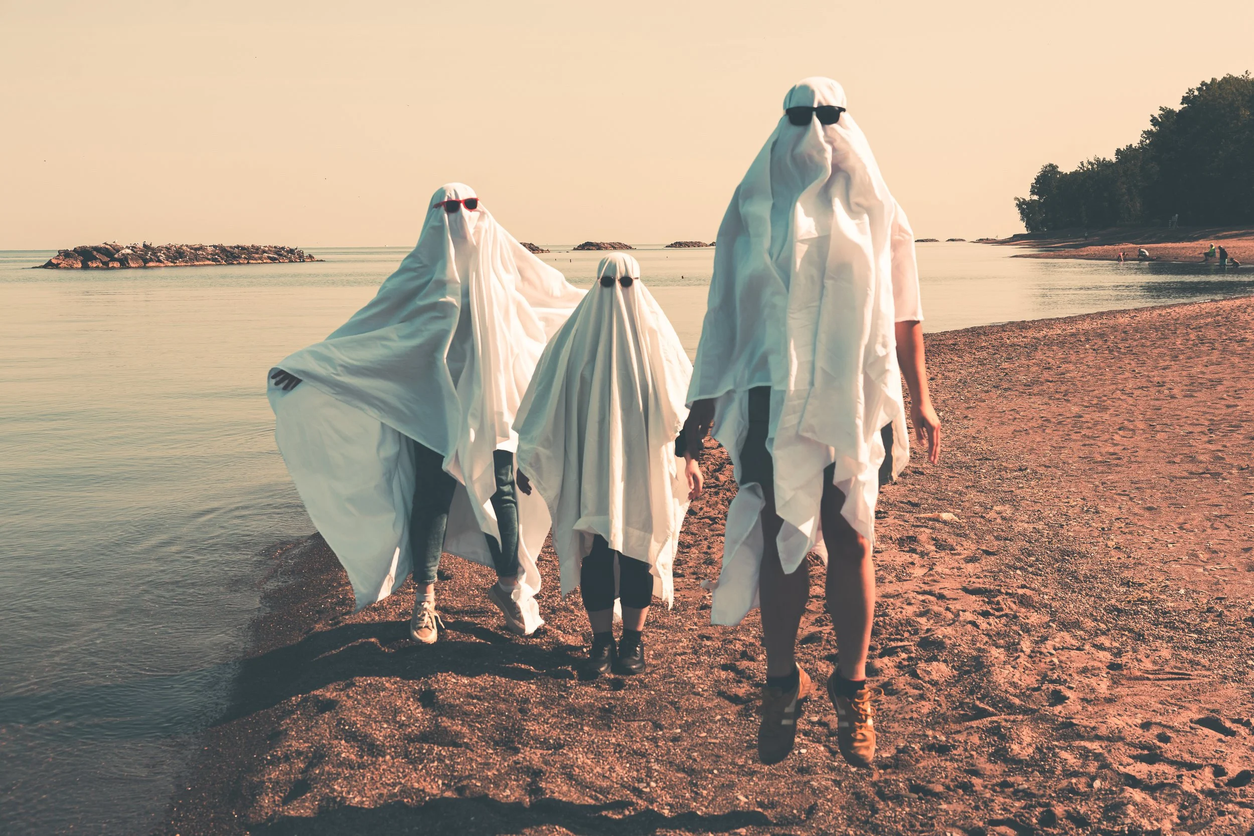 Three ghost friends at the beach. Sand, ghosts, beach.