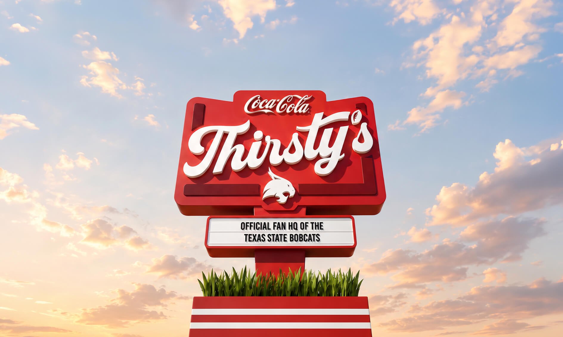 A sign for Thirsty's, sponsored by Coca-Cola, with a logo of a bobcat and a caption stating it's the official fan headquarters of the Texas State Bobcats, set against a sky with clouds at sunset.