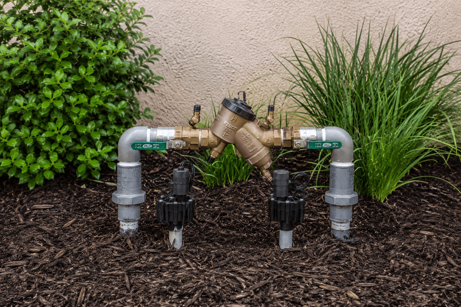 Residential pressure vacuum breaker backflow prevention assembly installed in a home lawn irrigation system