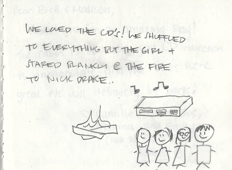 Handwritten notes with a drawing of a fire, four smiling girls, and a rectangular object with musical notes above it.