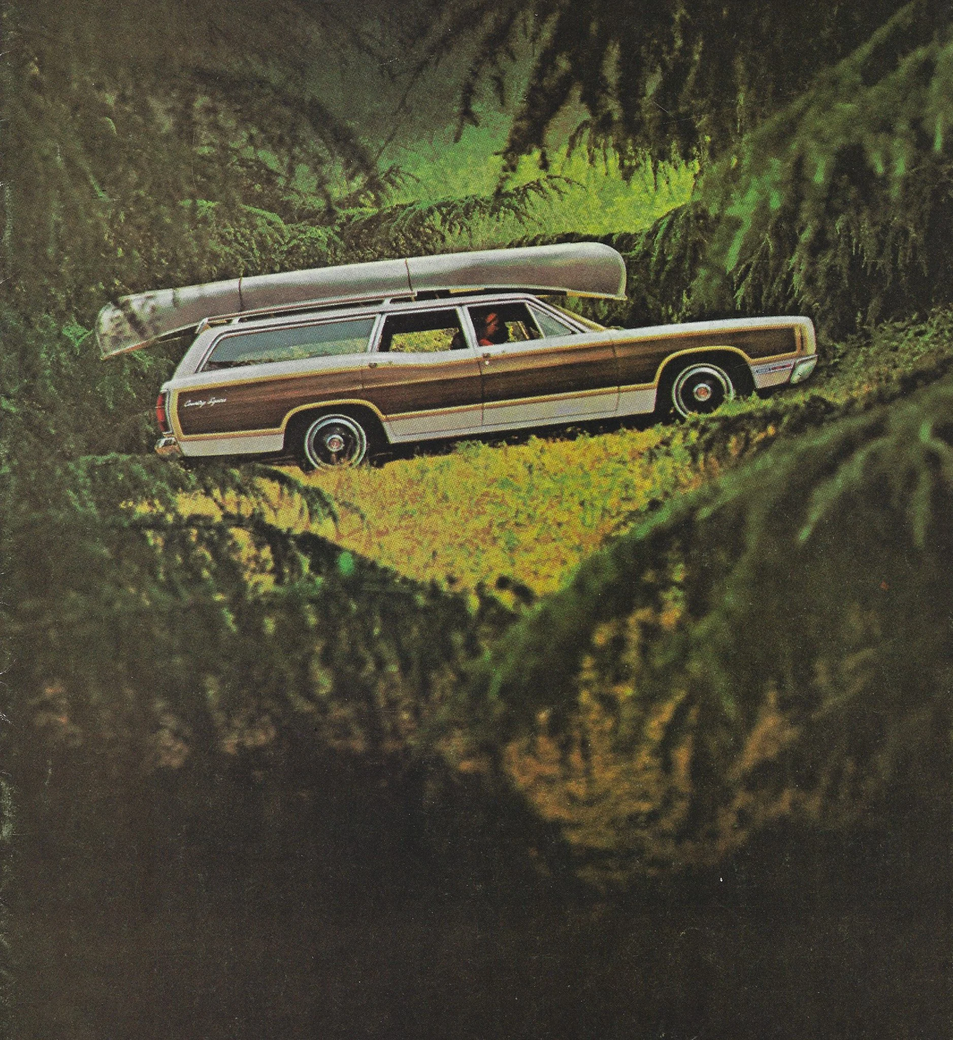 Vintage station wagon carrying a canoe through a forest