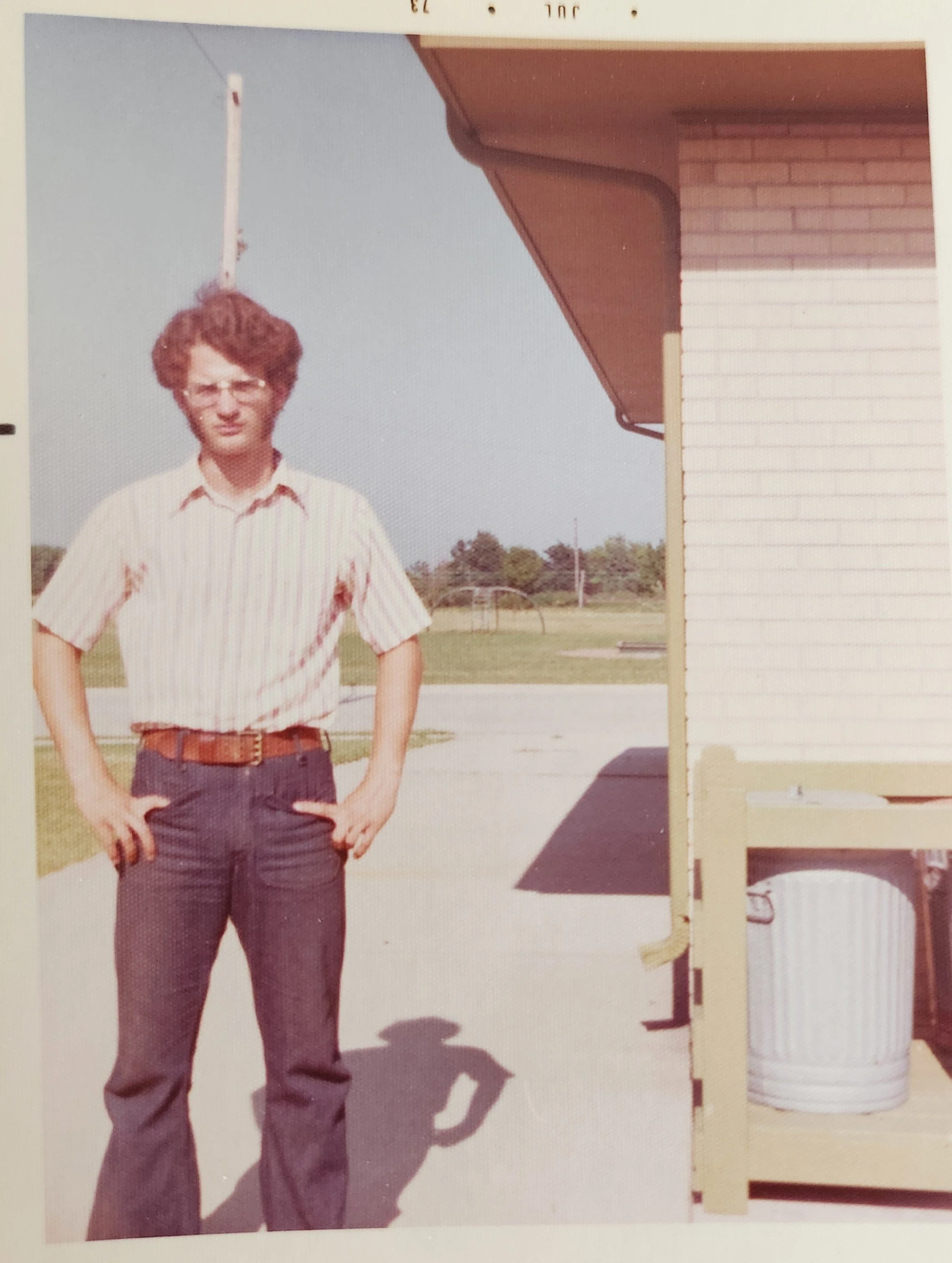 1973 - Standing by the back of the house I grew up in...with the park across the street