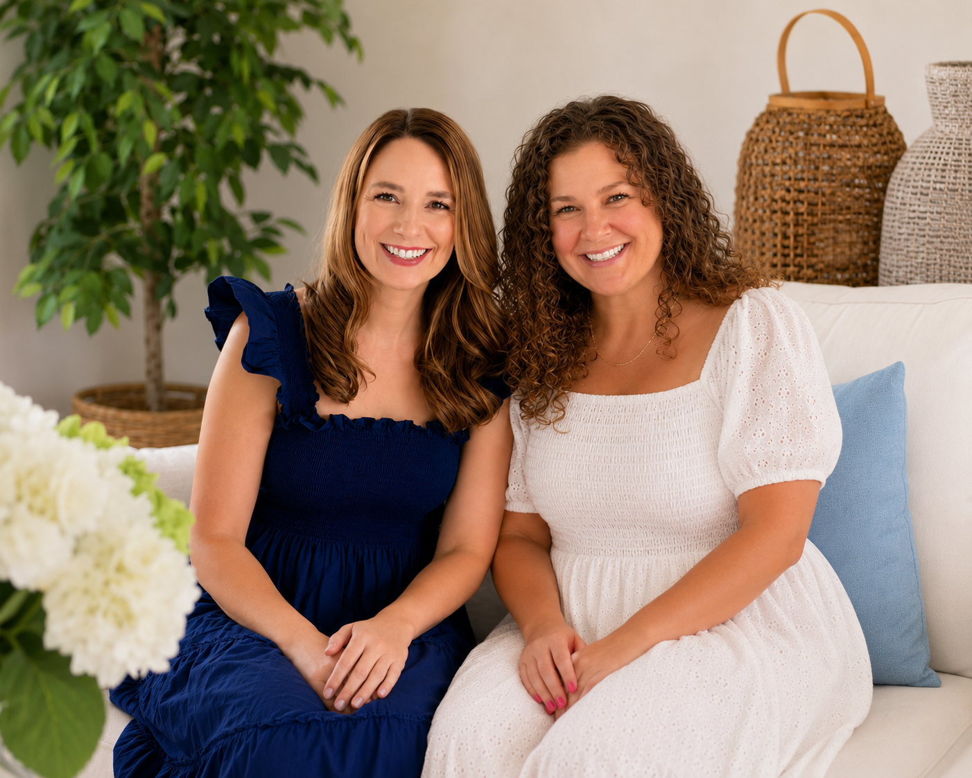 Founders of DigitalmarketHERs, Nicole Millsfield and Lacey Budd, smiling together in a bright living room, helping women build career optionality through digital business and online income.