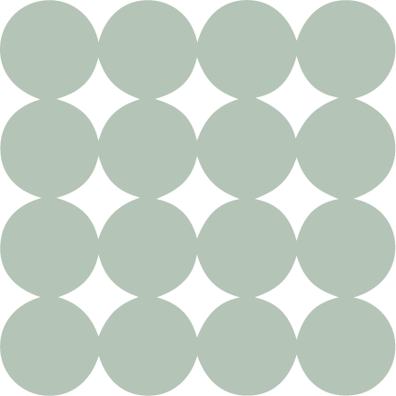 A pattern of light green circles arranged in a grid with white star-shaped gaps between them.