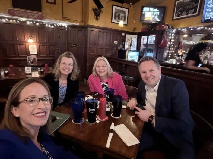 Four people at a restaurant table